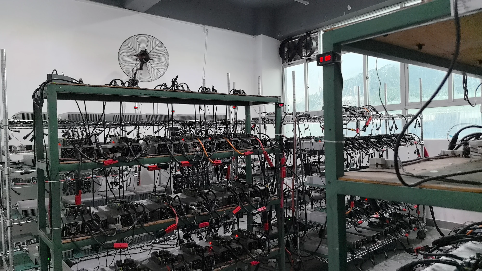 Power assemblies and connected cables on factory racks