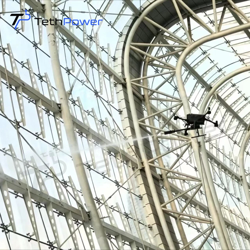TethPower TP-M400-SG2 cleaning a glass-roof structure