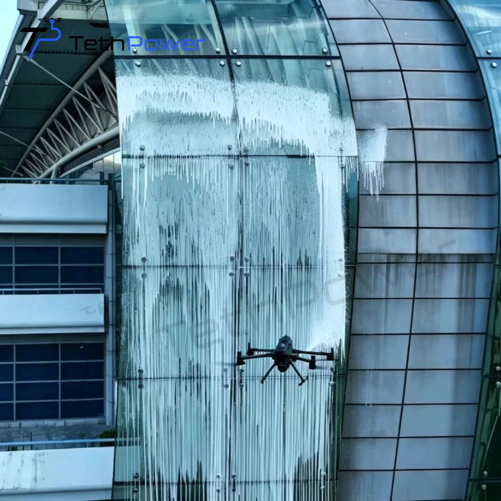 TethPower TP-M400-SG2 cleaning a vertical glass facade
