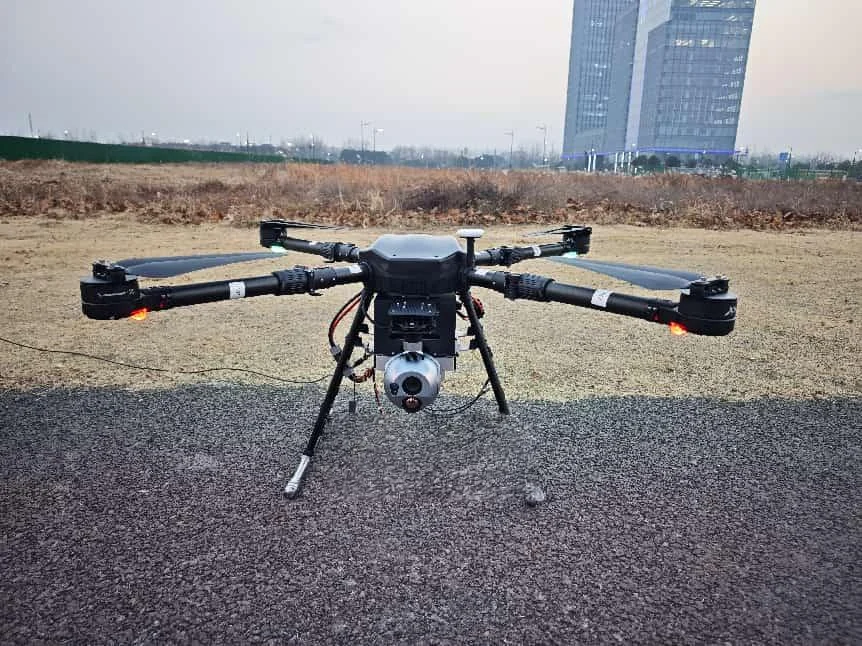 Industrial tethered surveillance UAV with an EO thermal camera payload.