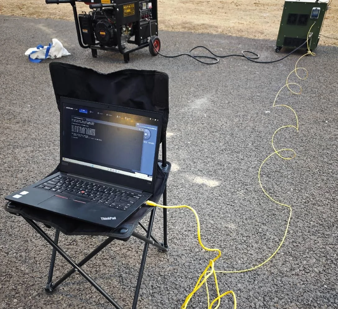 Field command laptop, generator and fiber-optic tethered drone ground station.